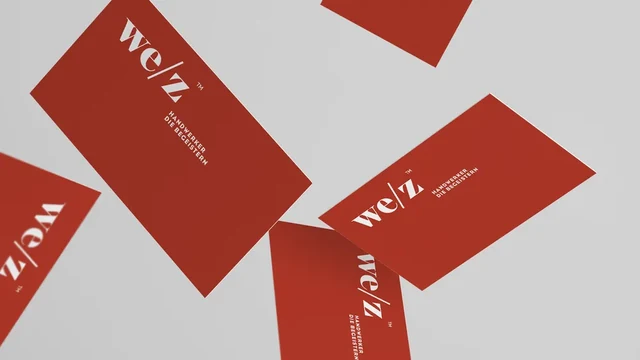 Крупные красные визитки Welz на сером фоне — ИЗДИДЖИТЛ